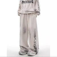 ACID WASHED INITIAL PANTS
